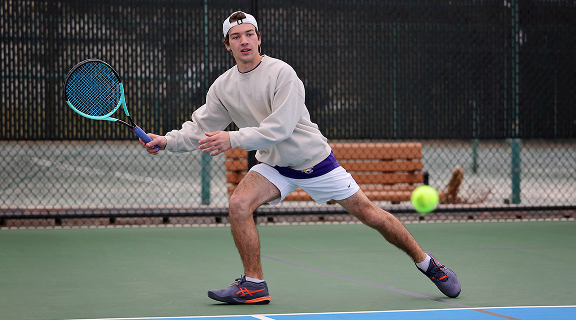 A Scots tennis player runs to return a serve.