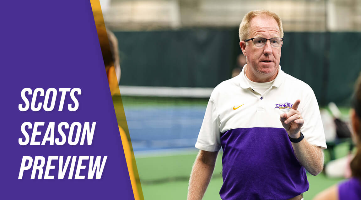 Women's Tennis Coach, Jim Stockwell, in a purple and white MCC Scots polo, giving instructions on an indoor tennis court.
